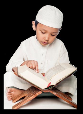 Boy reading the Quran on a wooden rehal stand