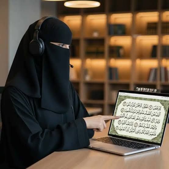 Female Quran tutor in niqab teaching an online class